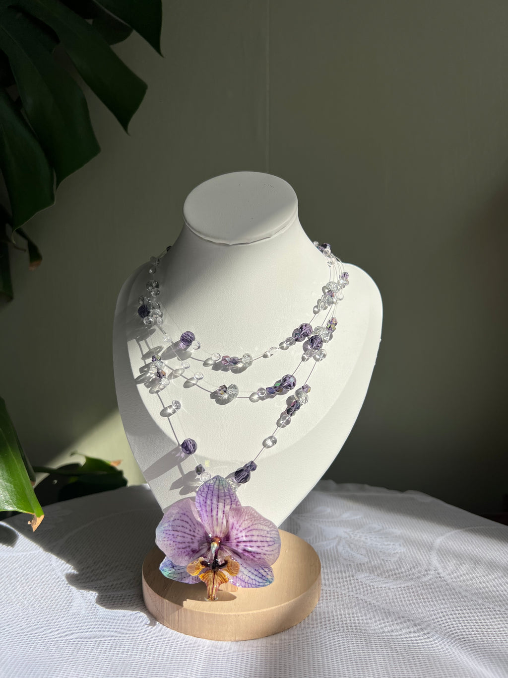 Ianthe handcrafted botanical necklace on display bust with purple orchid — smo studio 