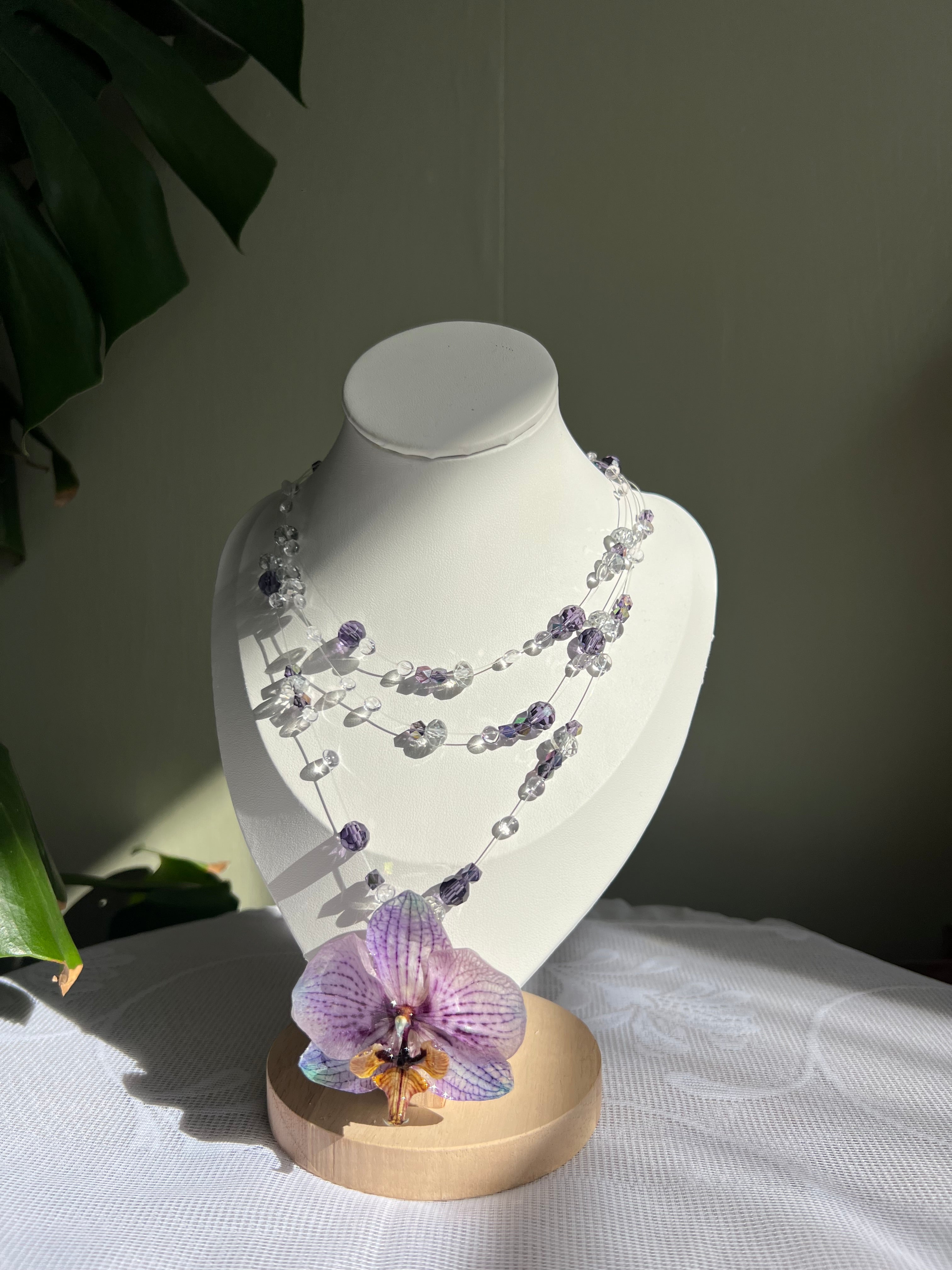 Ianthe handcrafted botanical necklace on display bust with purple orchid — smo studio 